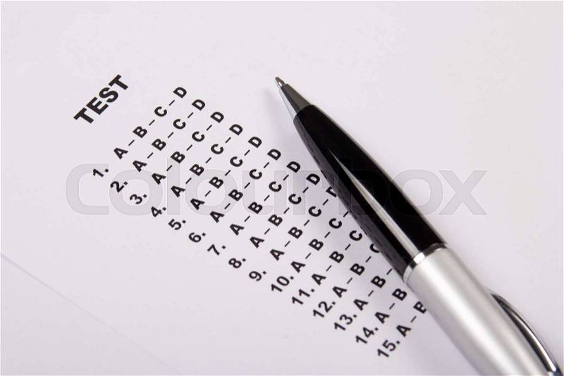 Test score sheet with answers and metal pen, stock photo