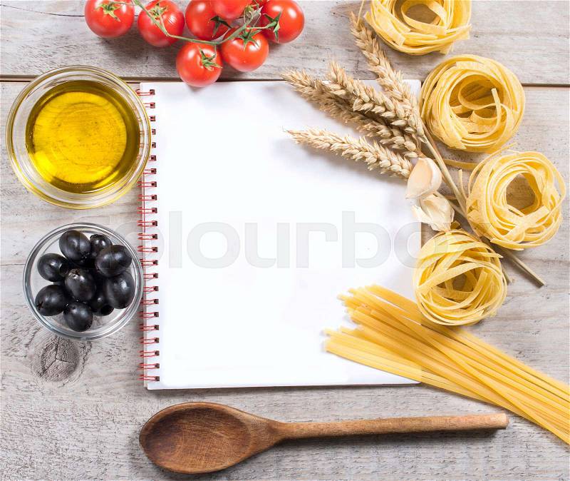 Cooking book with traditional Italian pastas and ingrediants,blank space , stock photo