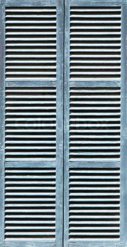 Window with lightsteelblue shutters. Close-up view, stock photo