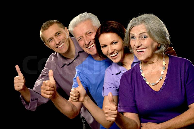 Portrait of a cute family with senior parents, stock photo