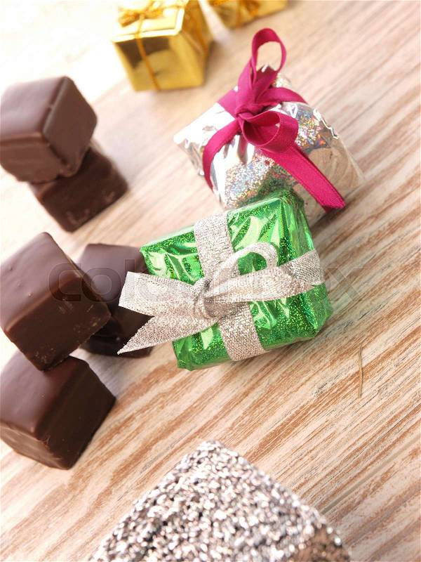 Colorful gift boxes with chocolate dices, stock photo