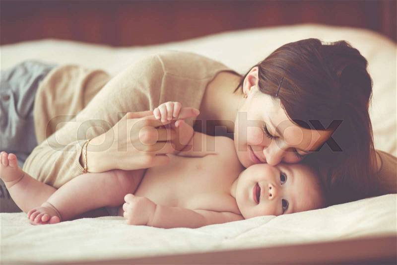 Portrait of a mother with her 4 months old baby, stock photo