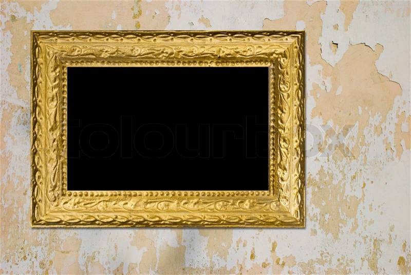 Old grunge wall with vintage gold frame, stock photo