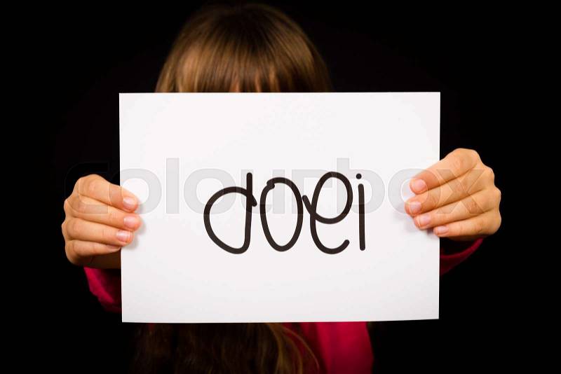 Studio shot of child holding a sign with Dutch word Doei - See you later, stock photo