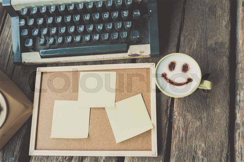 Vintage typewriter sticky paper on the wood desk in vintage color tone, stock photo