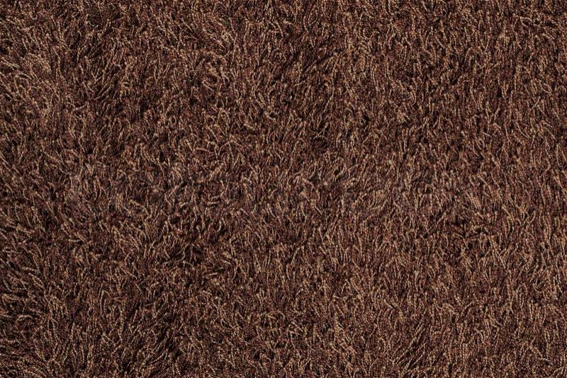 New brown fluffy rug background texture, stock photo
