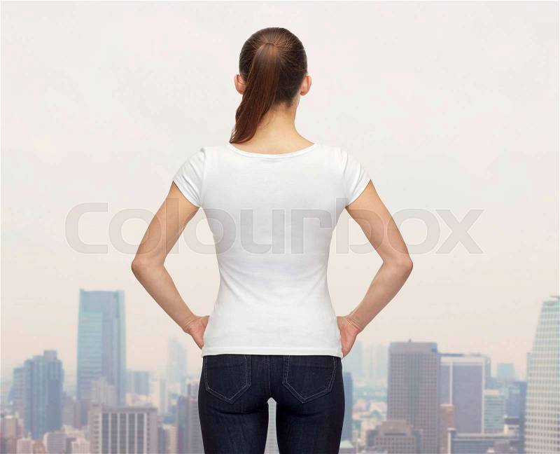T-shirt design, advertisement and people concept - woman in blank white t-shirt from back over city background, stock photo