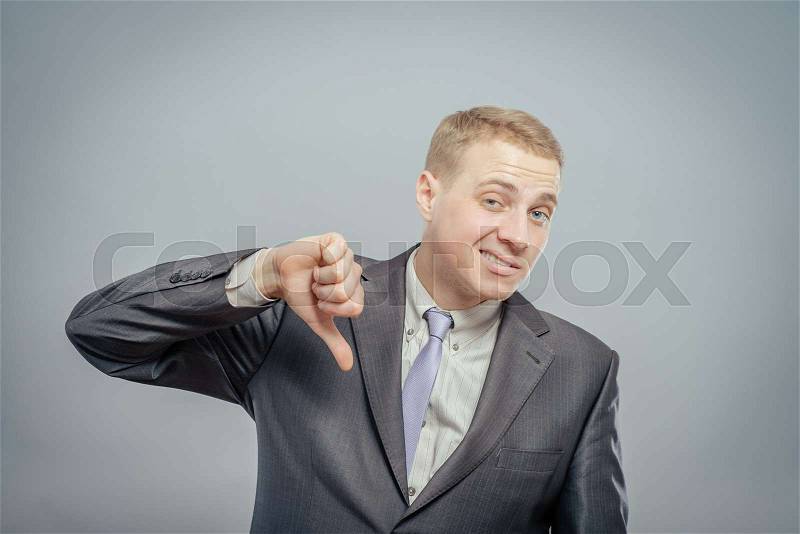 A businessman expressing his opinion on something in a negative way, not easily misinterpreted, stock photo