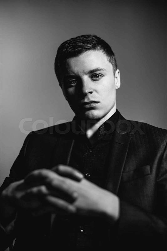 Young man's face. Close-up portrait. Black-white photo, stock photo
