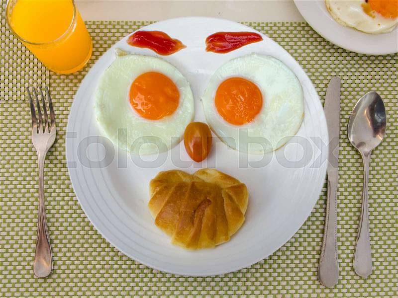 Happy Face Frying Eggs breakfast, stock photo