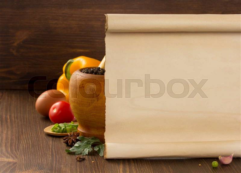 Food spice and old paper on wooden background, stock photo