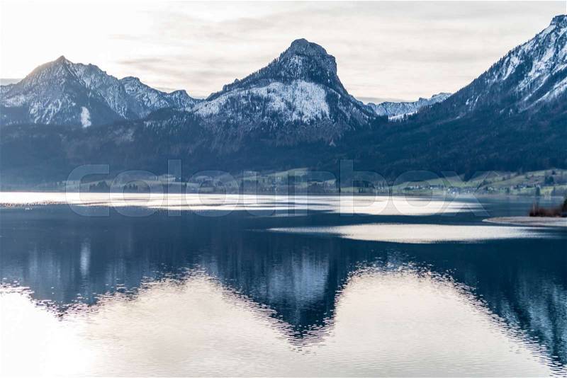 In the wolfgangsee, the surrounding mountains are reflected. austria, upper austria, salzburg country, stock photo