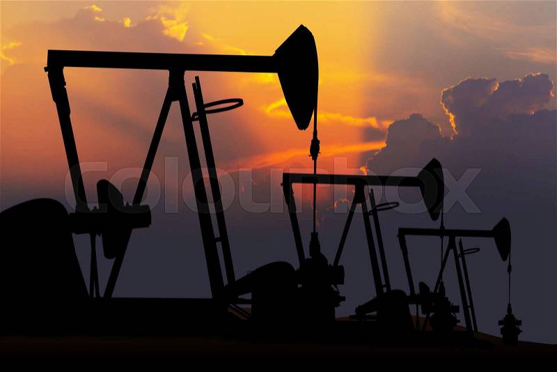Oil pump oil rig energy industrial machine for petroleum at sunset, stock photo