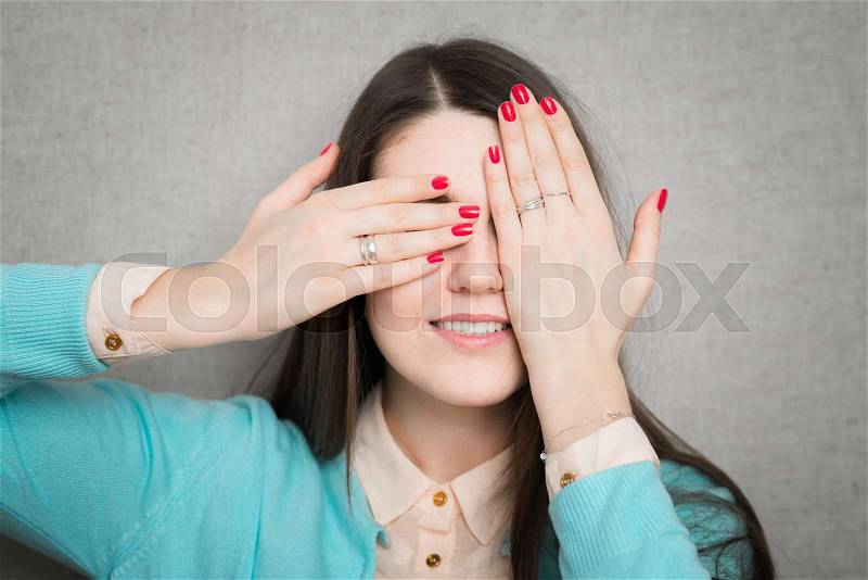 Girl closes her eyes with a smile on his face, stock photo