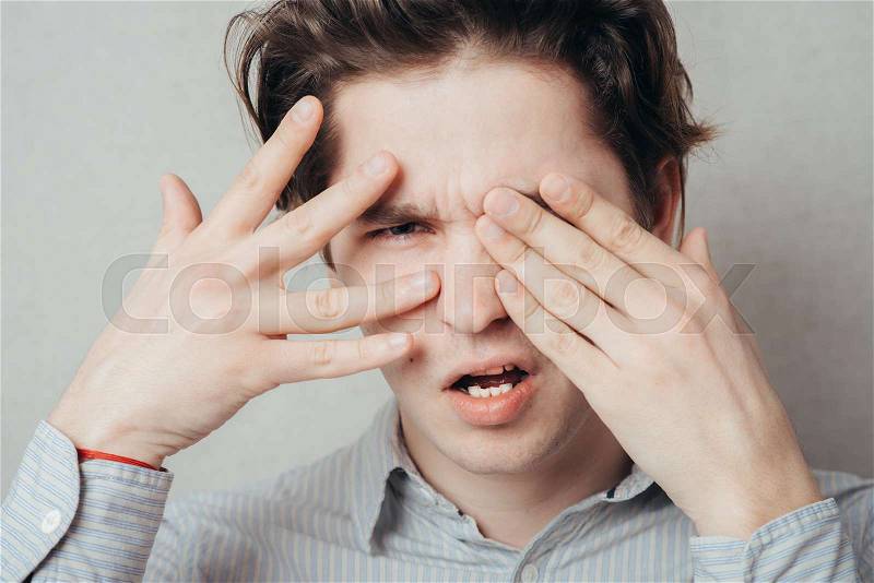 13185800-portrait-of-man-closed-one-eye-with-his-hand.jpg