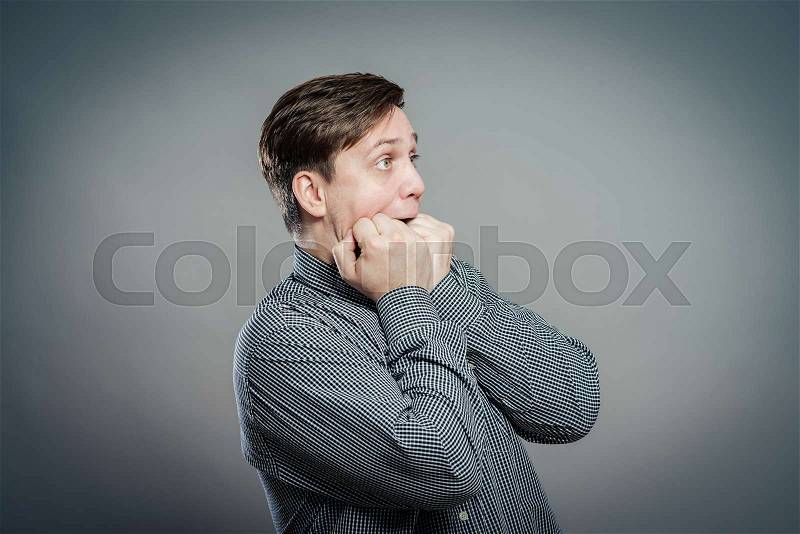 Fear, man is afraid in shirt with funny expressions, stock photo