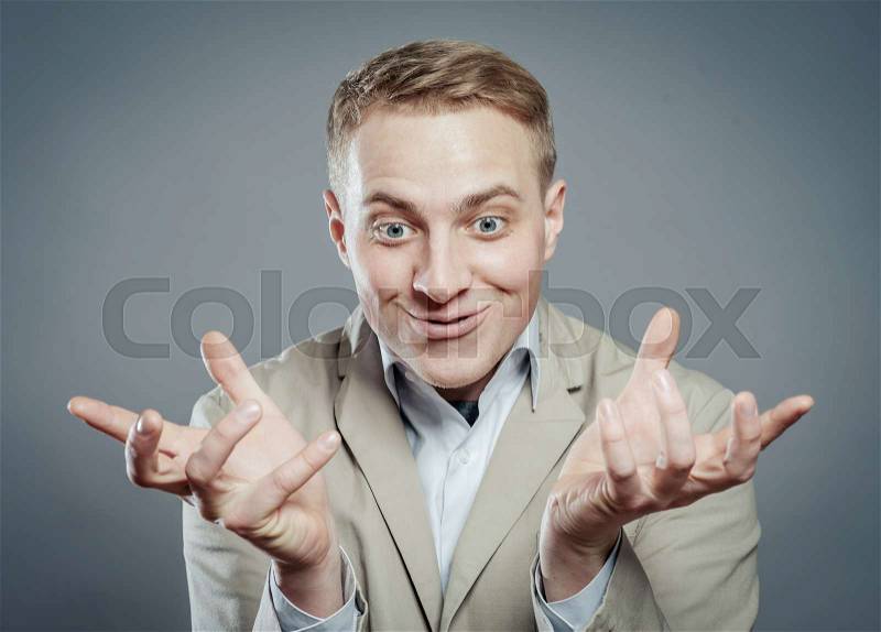 Surprised man looking on hands , stock photo