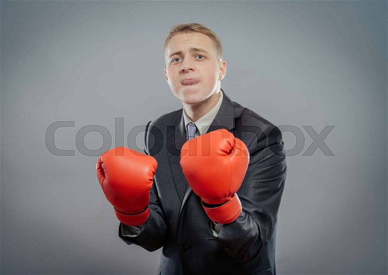 Businessman in boxing gloves cause to fight isolated , stock photo