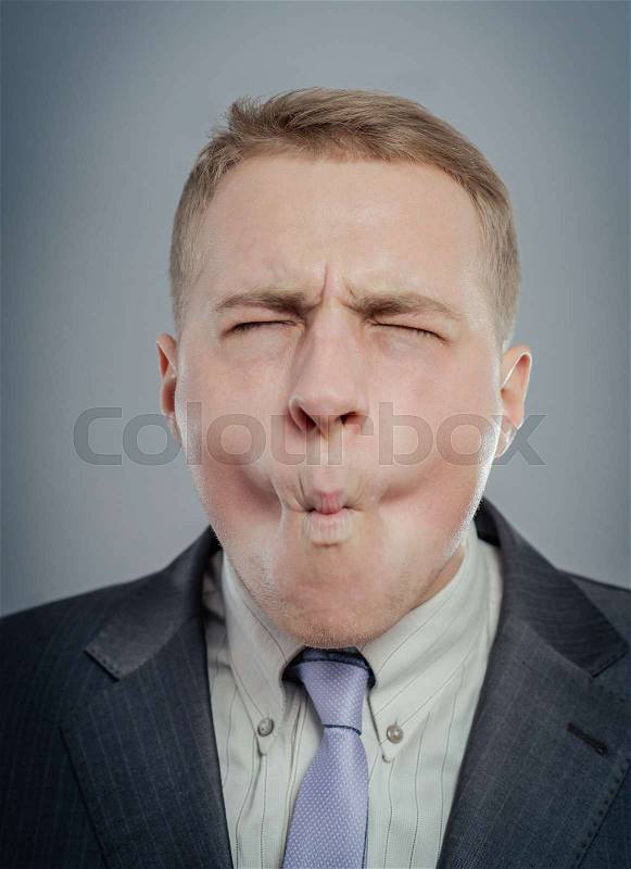 A real funny face with close eyes captured in high detail, stock photo
