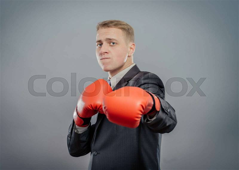 Businessman in boxing gloves isolated , stock photo