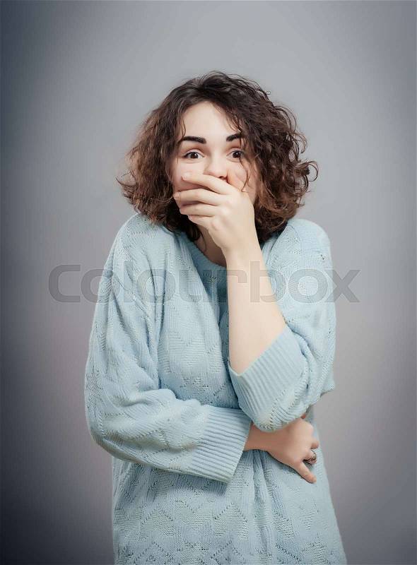 Woman shutting her mouth, stock photo