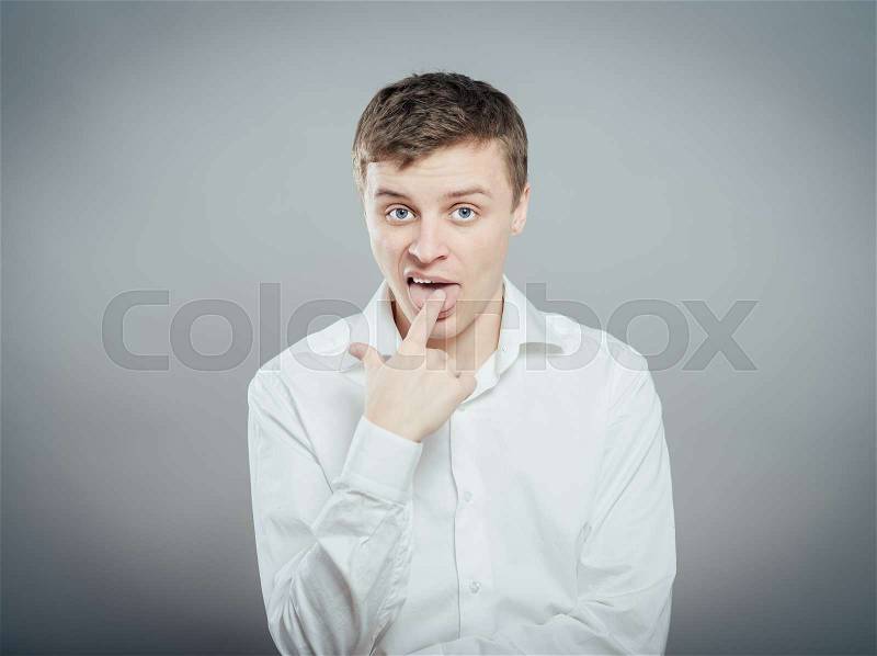 Thinking man finger in mouth, stock photo