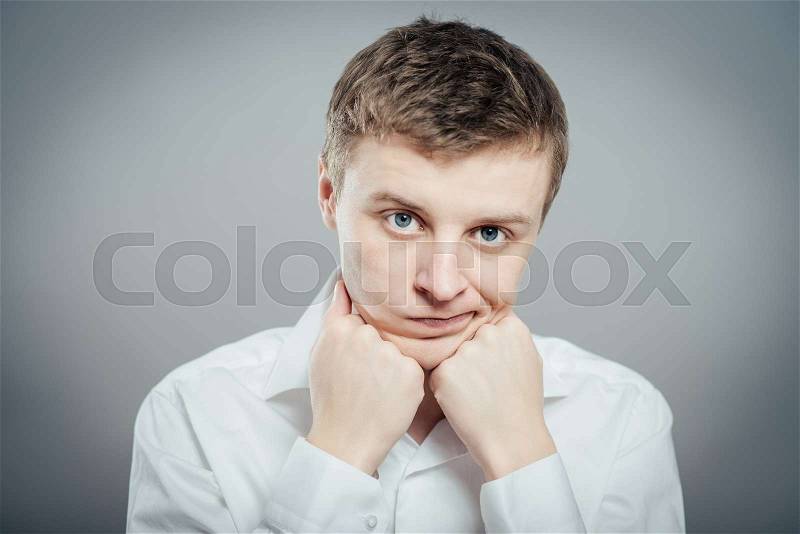 Closeup portrait of a groggy upset worried sad, depressed, tired business man with a headache and very stressed hand in hair, isolated , Negative human emotion facial expression, stock photo