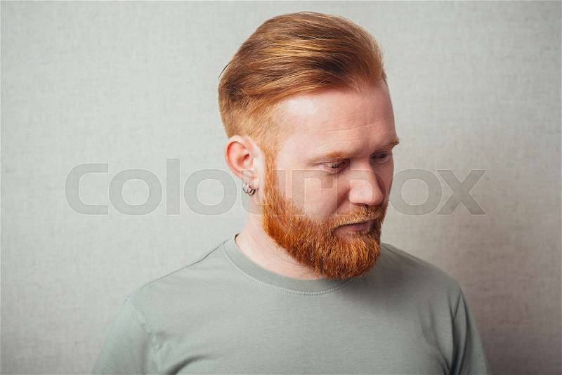 portrait of a Young red bearded Man feel bad, sad, stock photo