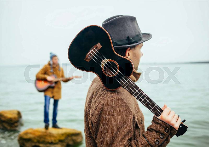 Acoustic music band on the lake, stock photo