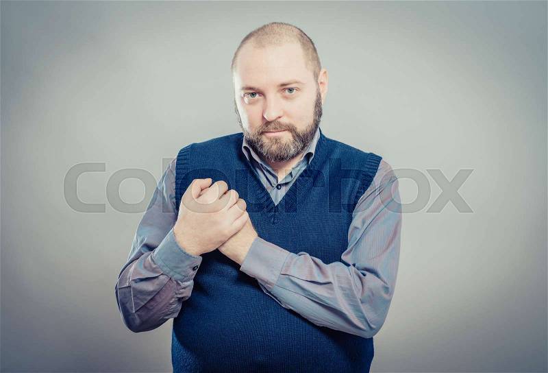 Man with his hand on heart taking an oath, stock photo