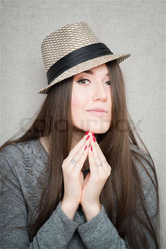 Portrait of a Beautiful Young Woman in hat. Retro Style, stock photo