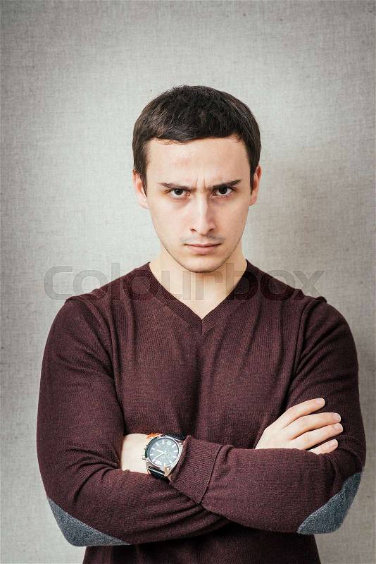 Portrait of disgusted man looking at the camera, stock photo