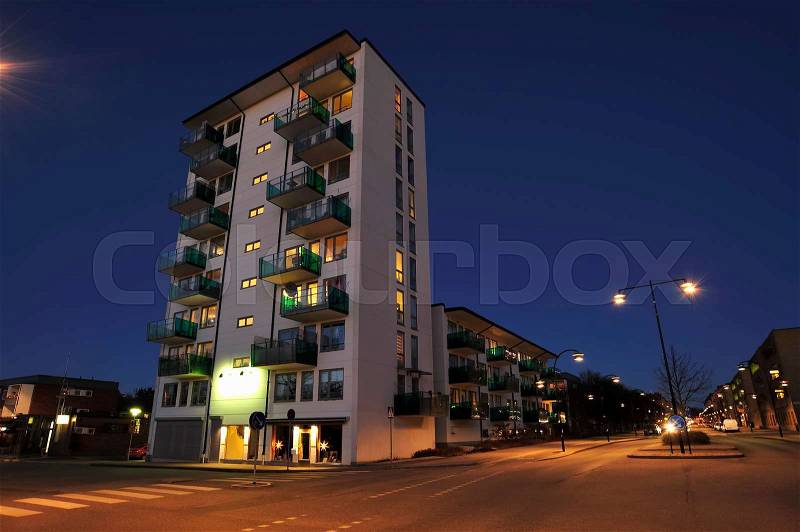 Swedish apartment block at night, stock photo