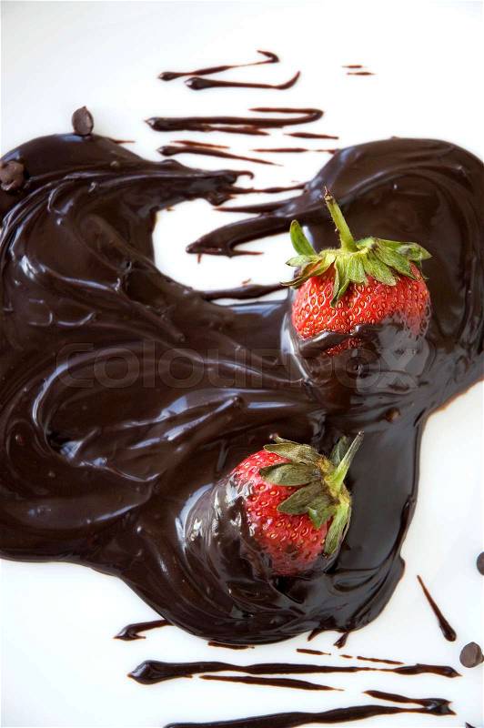 Close up fresh strawberry dip in chocolate, stock photo