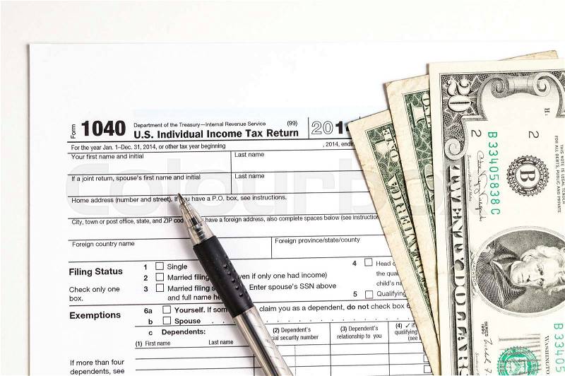 Tax form and Money. Filling the forms and hoping for a tax refund return, stock photo