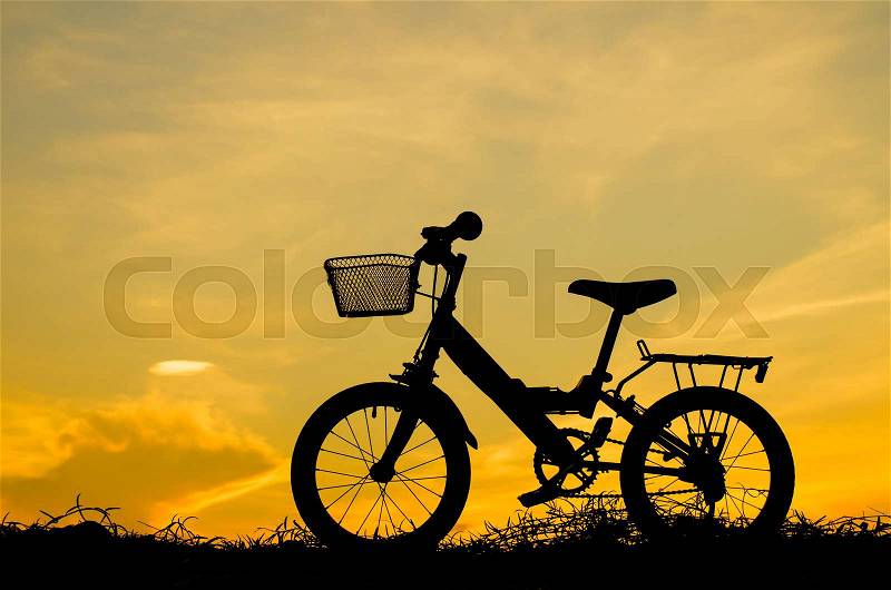 Mountain bike silhouette in sunrise, stock photo