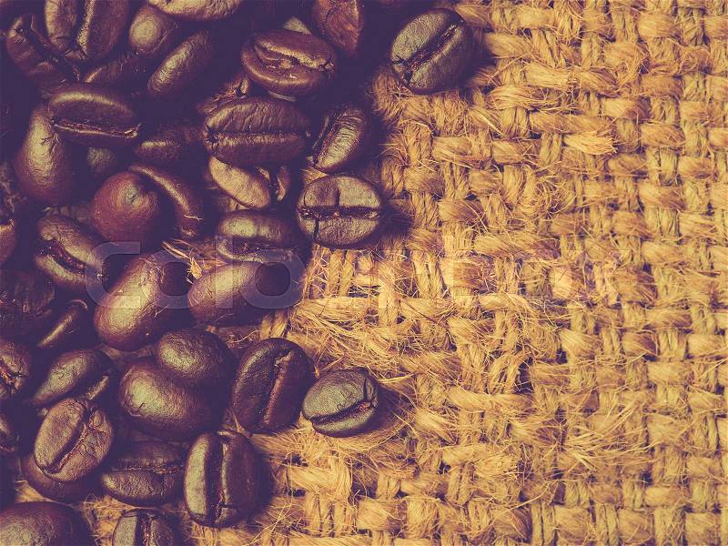 Coffee beans on canvas,Selective focus coffee beans,vintage color toned image, stock photo