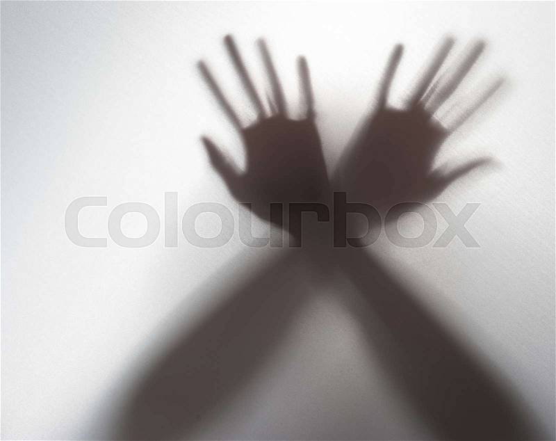 Silhouette of a hand in the back light,blur image, stock photo