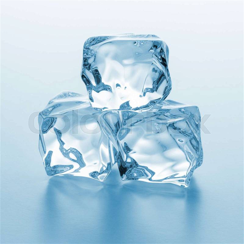 A pile of three clear ice cubes on blue gradient background. Taken in Studio with a 5D mark III, stock photo