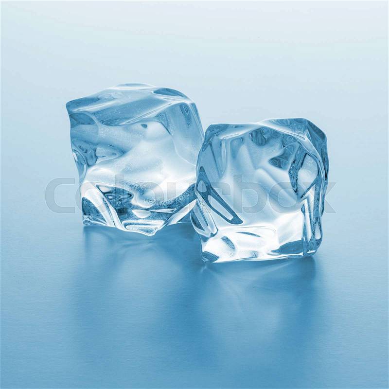 A group of two ice rocks on blue gradient background. Taken in Studio with a 5D mark III, stock photo