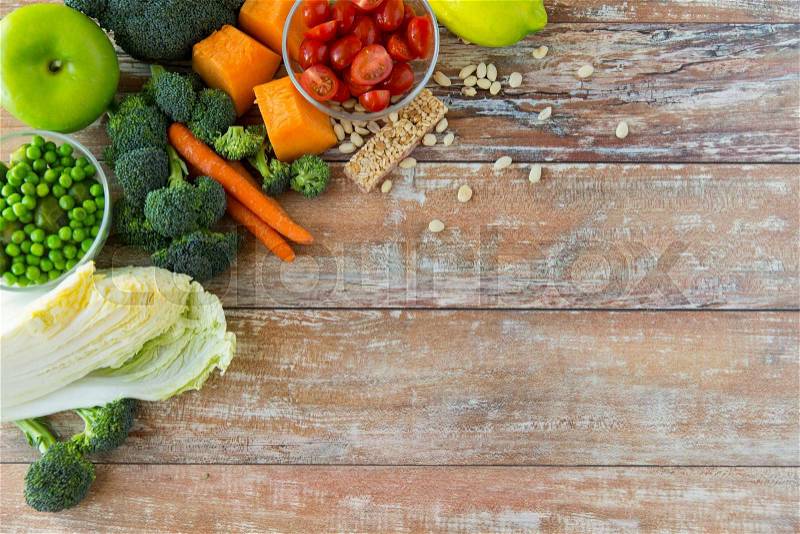 Healthy eating, vegetarian food, advertisement and culinary concept - close up of ripe vegetables on wooden table, stock photo