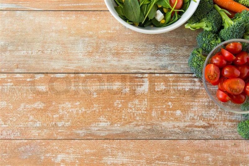 Healthy eating, vegetarian food, advertisement and culinary concept - close up of ripe vegetables on wooden table, stock photo