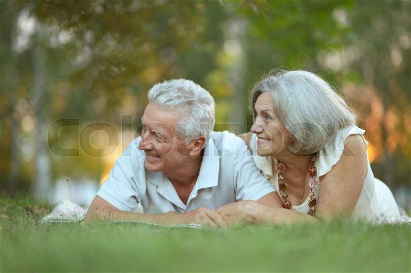 Beautiful happy old people in the park, stock photo