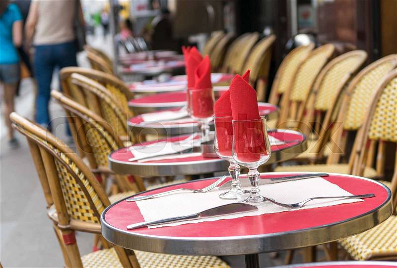 Montmartre restaurant with people walking, stock photo