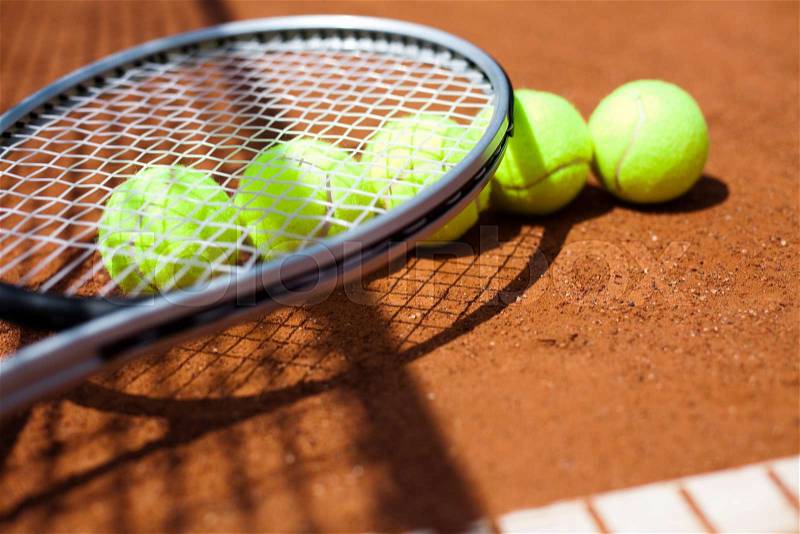 Tennis racket and balls, court, stock photo