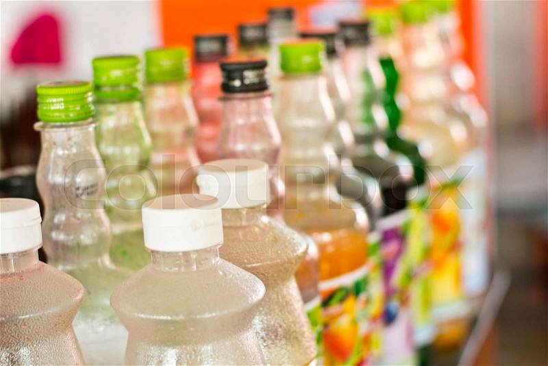 Sweet water bottles lined up on the shop, stock photo