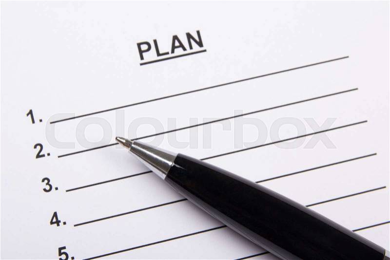 Close up of sheet of paper with plan and metal pen, stock photo