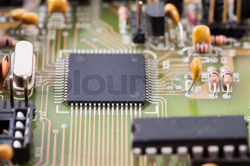 Electronic chip on circuit board. Circuit board with electronic components, stock photo