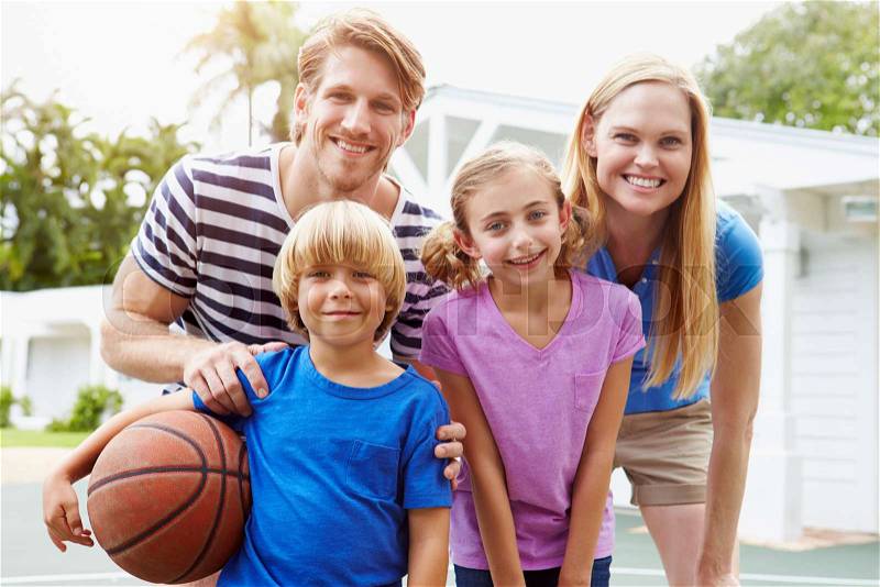 Portrait Of Family Playing Basketball Together, stock photo