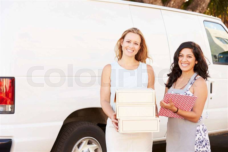 Two Women Running Catering Business With Van, stock photo